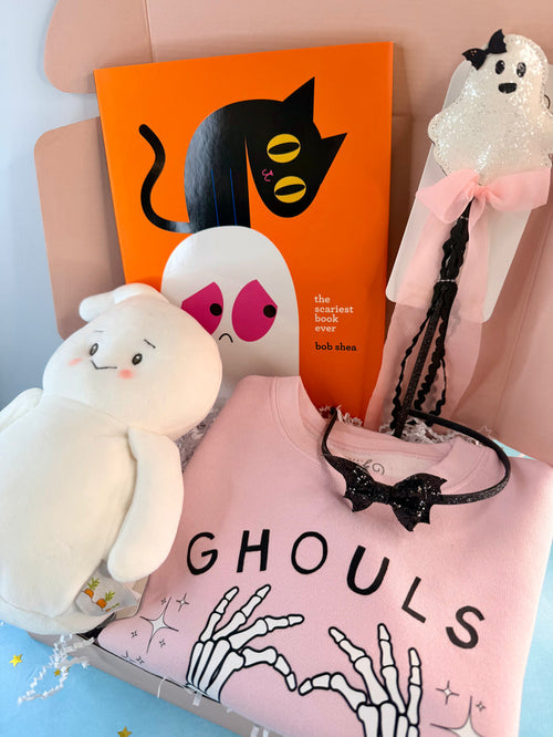 Pink Ghouls Halloween gift box for girls ages 3–6 with a Halloween top, ghost plush, book and spooky accessories.