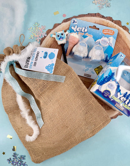 Pet product packaging with a drawstring bag on a textured surface