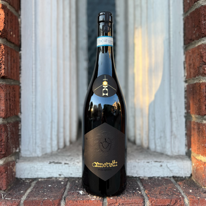Amorotti Montepulciano wine bottle, foil neck label and gold emblem on front