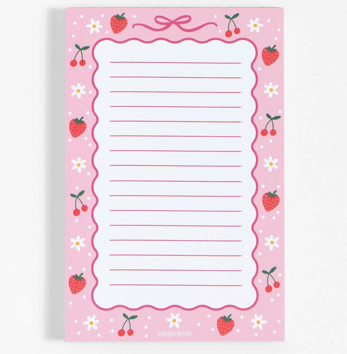 Notepad with strawberry and cherry design on a pink background