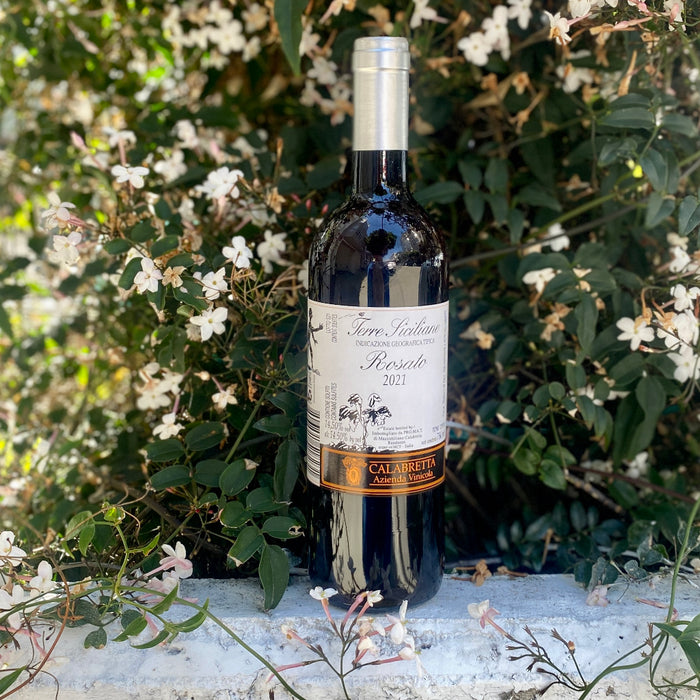 Calabretta Rosato wine bottle with silver cap and cream label