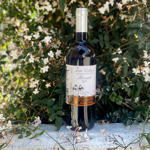Calabretta Rosato wine bottle with silver cap and cream label
