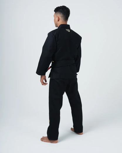 Kingz Comp 450 V6 BJJ Gi Black - Full Back View Male Athlete Wearing Black Competition Kimono Gold Crown Logo Back Collar Barefoot