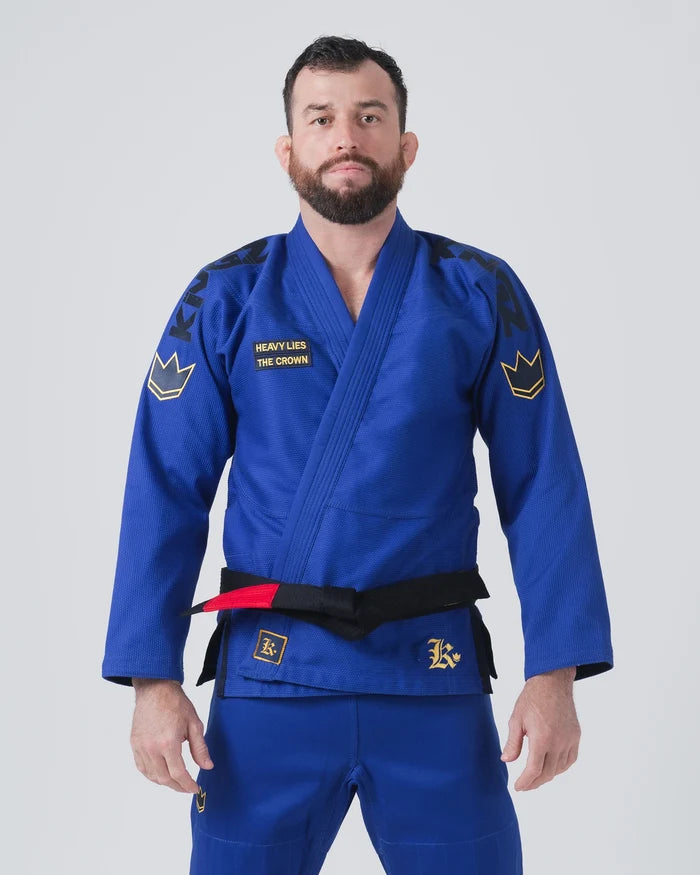 Kingz Comp 450 V6 Jiu Jitsu Gi - Blue - Front View Male Athlete Black Belt Yellow Crown Patch Shoulder Embroidery Heavy Lies The Crown Text Durable Weave BJJ Gi Training [color:Blue]