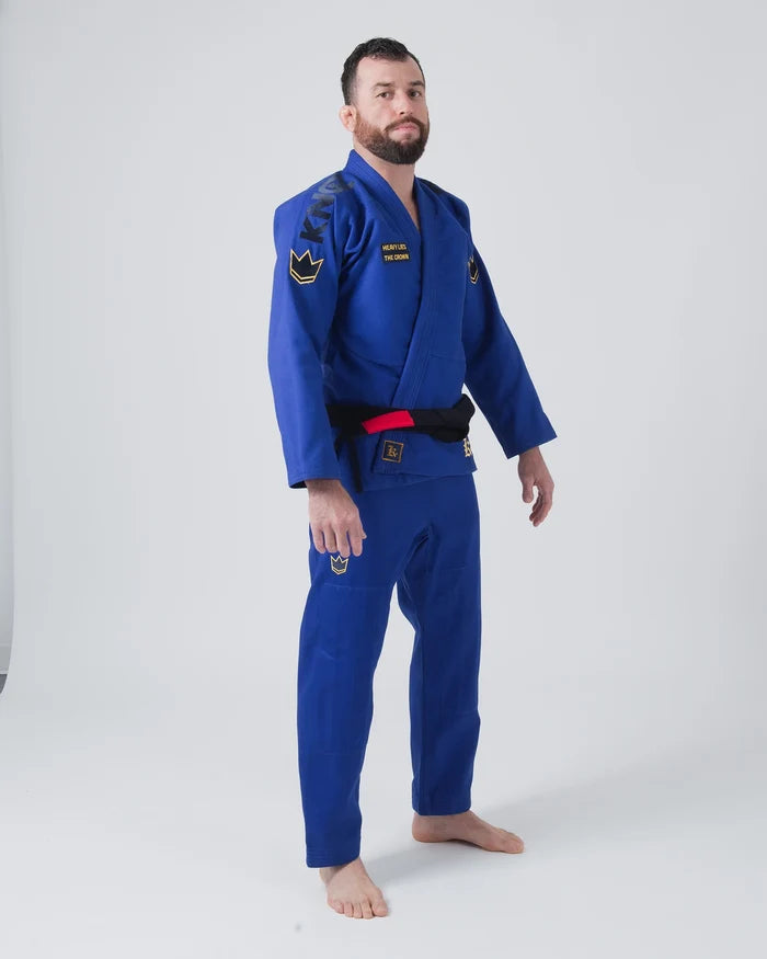 Kingz Comp 450 V6 Jiu Jitsu Gi - Blue - Full Body Front View Male Athlete Blue Gi Black KINGZ Shoulder Text Yellow Crown Badge Chest and Pants Durable Stitching BJJ Training Gi [color:Blue]
