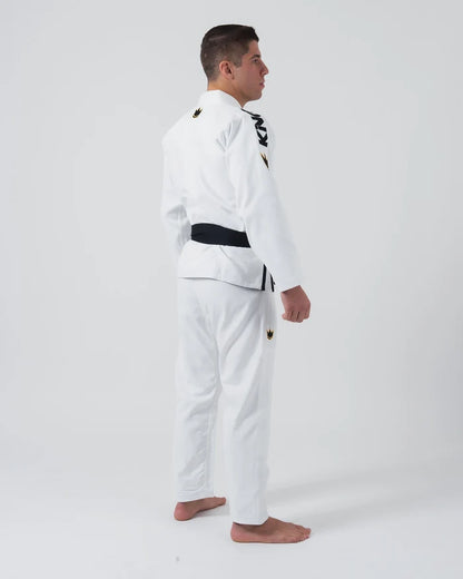 Kingz Comp 450 V6 Jiu Jitsu Gi - White - Side View Male Athlete White Gi Black KINGZ Text Chest Crown Badge Shoulder and Thigh Traditional Fit BJJ Gi Training Jiu Jitsu Gear [color:White]