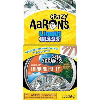 Crazy Aaron's Liquid Glass Thinking Putty in a 3.2 oz round tin with a bright yellow and blue retail card backing, showing the product name and a small hand demonstrating the clear, stretchy putty.