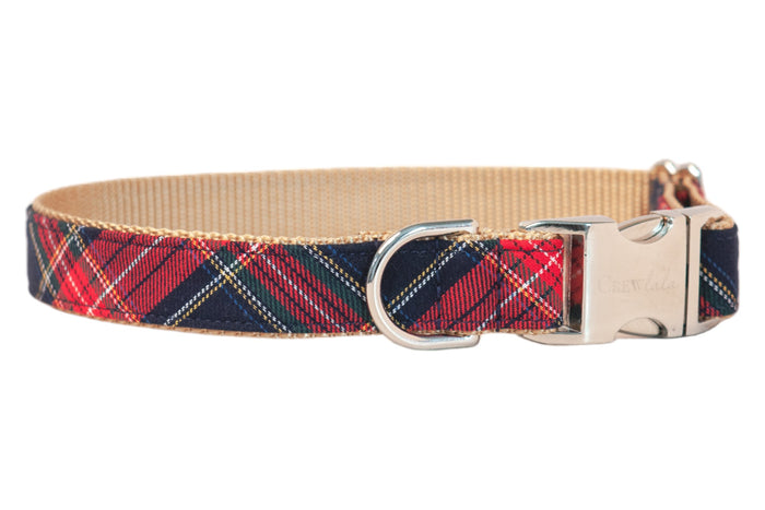 Classic plaid dog collar with a red  tartan pattern on top of nylon webbing. It includes a shiny buckle clasp engraved with “CrewLala” and a matching D-ring.