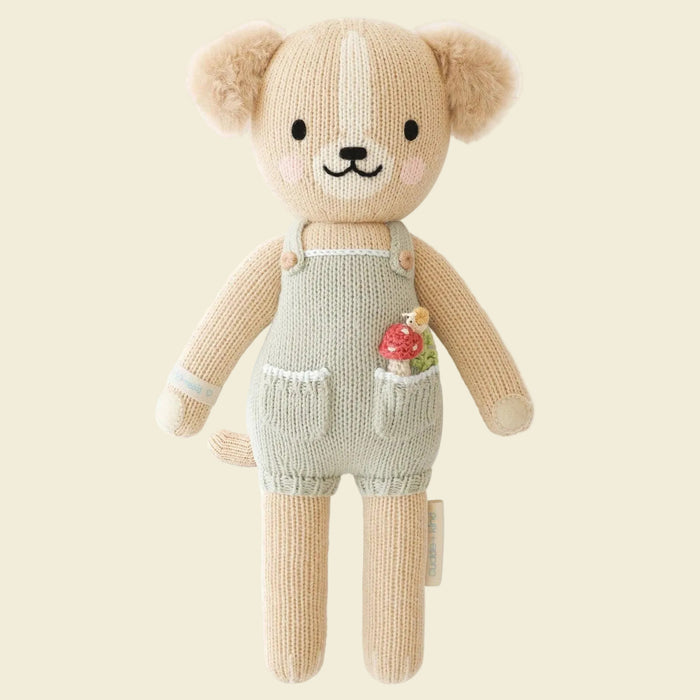 Knitted teddy bear toy with overalls