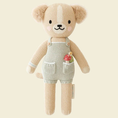 Knitted teddy bear toy with overalls