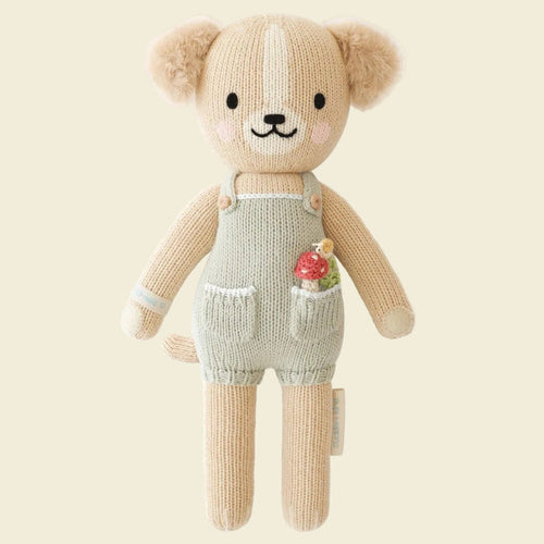 Knitted teddy bear toy with overalls