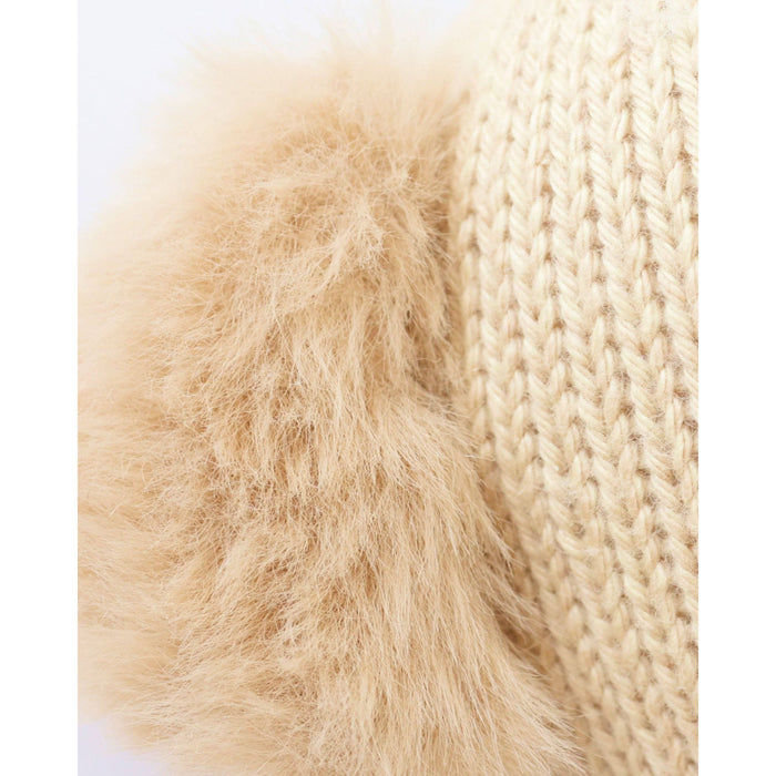 Close-up of beige fur and knitted fabric texture