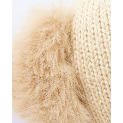 Close-up of beige fur and knitted fabric texture