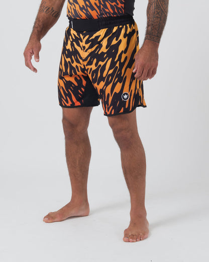 Kingz Flame Shorts Orange Black - Full Body Right Side Profile Male Athlete Bold Orange Black Tiger Flame Pattern Grappling Shorts Crown Logo White on Black Circle Right Outer Thigh Competition Cut Matching Flame Rashguard Bare Feet Men's No-Gi BJJ [color:Black/Flame]