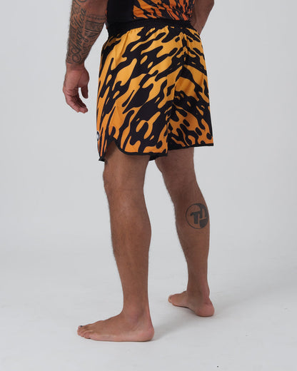 Kingz Flame Shorts Orange Black - 3/4 Back Left Angled View Male Athlete Bold Orange Black Tiger Flame Pattern Grappling Shorts Back Panel Competition Cut Black Waistband Matching Flame Rashguard Bare Feet Men's No-Gi BJJ [color:Black/Flame]