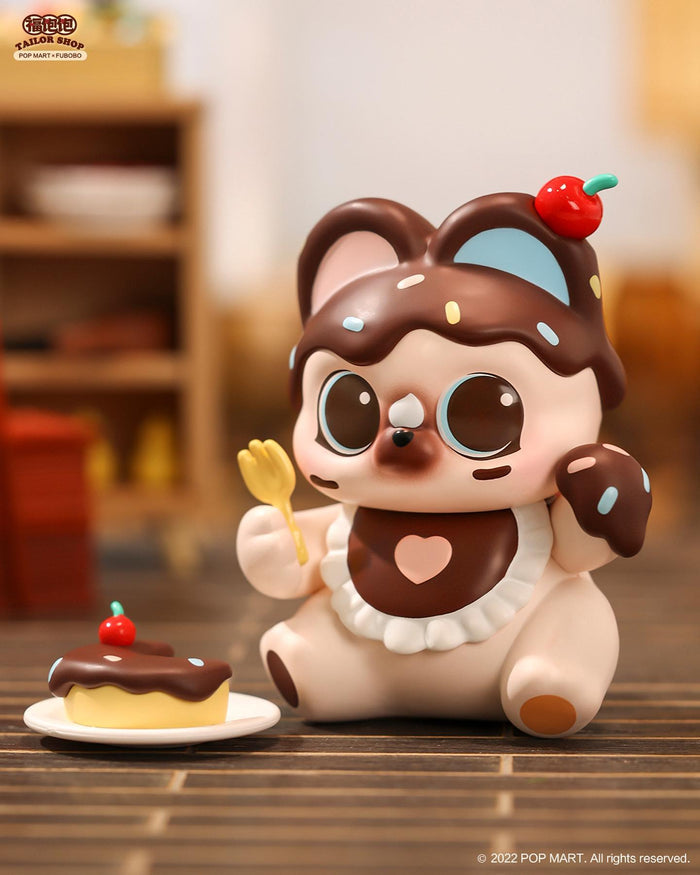 Toy animal with cake and spoon from FUBOBO Tailor Shop Blind Box Series.