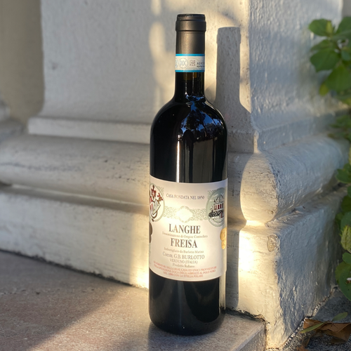 Langhe Freisa wine bottle by G.B. Burlotto, dark glass with label on side angle.
