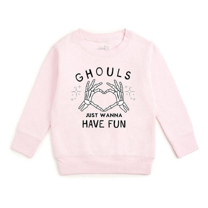 A light pink long-sleeve crewneck sweatshirt featuring a black graphic print of skeleton hands forming a heart shape with the text 'GHOULS JUST WANNA HAVE FUN' on a plain white background.