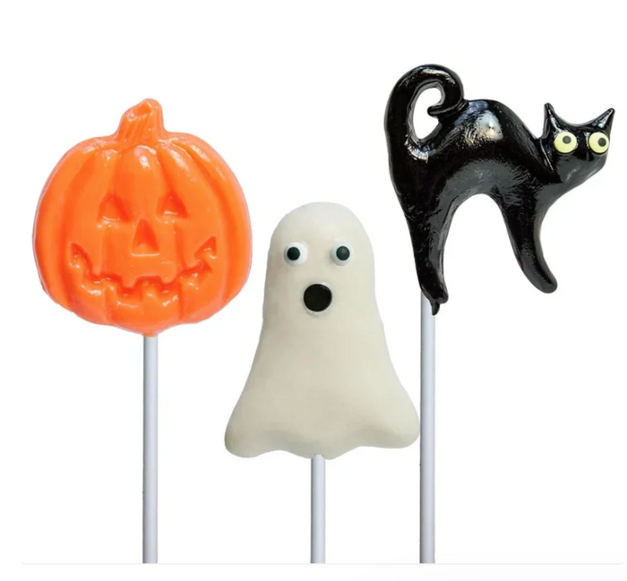 Three Halloween-themed lollipops on white sticks: an orange jack-o'-lantern, a white ghost with a surprised face, and a glossy black cat with yellow eyes.