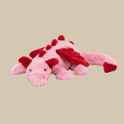 Pink dragon plush with red wings, spikes, ears, and tail.