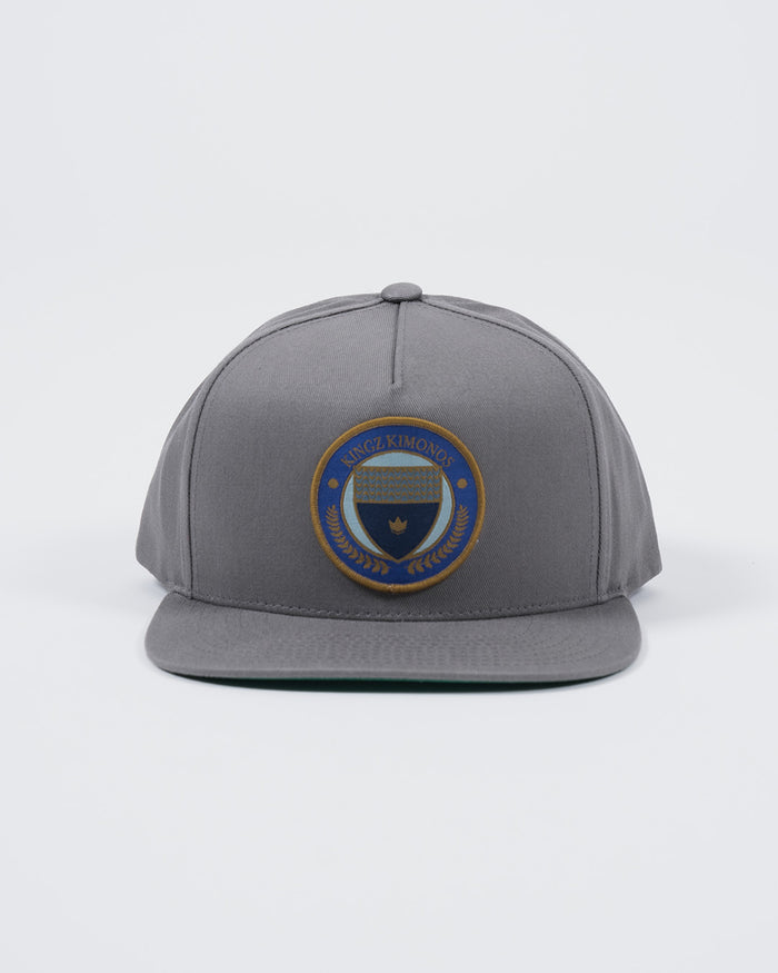 Kingz Jiu Jitsu Club Snapback Grey - Front View Embroidered Circular Badge Center Crown Logo Flat Brim Structured Fit BJJ Hat [color:Grey]
