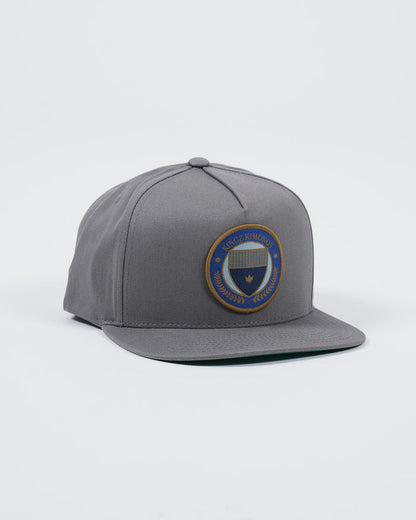 Kingz Jiu Jitsu Club Snapback Grey - Angled Front View Embroidered Patch Center Panel Blue Gold Circle Design Flat Brim Structured Fit BJJ Training Hat [color:Grey]
