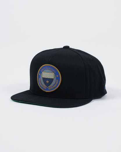 Kingz Jiu Jitsu Club Snapback Black - Angled Side View Embroidered Patch Front Crown Badge Gold Blue Detailing Flat Brim Classic Fit BJJ Grappling Hat [color:Black]