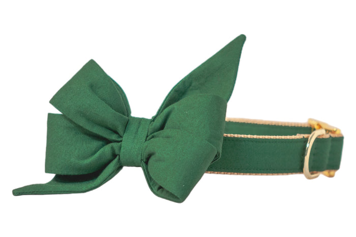 A vibrant kelly green dog collar with a dramatic oversized bellebow and polished hardware—perfect for pups who love making a bold and festive fashion statement.