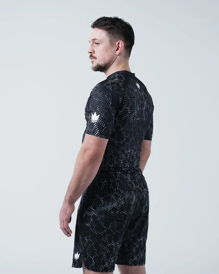 Kingz Acid Wash Rashguard Black - Full Body Left Side Profile View Male Athlete Short Sleeve Crown Logo Acid Wash Dot Pattern Matching Shorts KINGZ Text Compression Fit [color:Black/Acid]