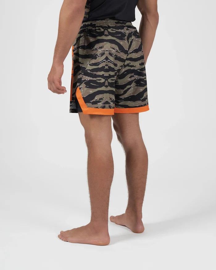 Kingz Always Hunting Shorts Green Camo - Full Body Left-Back Side Profile Male Athlete Tiger Camo Pattern Orange Bold Side Accent Panel Inner Compression Shorts Orange Hem Visible Competition Cut Men's Grappling Shorts No-Gi BJJ [color:Green Camo]