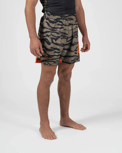 Kingz Always Hunting Shorts Green Camo - Upper Body Front View Male Athlete Tiger Camo Pattern Orange Bold Side Panel Right Side KINGZ Badge Orange Accent Stripe Competition Cut Men's Grappling Shorts No-Gi BJJ [color:Green Camo]