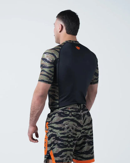 Kingz Always Hunting Rashguard Green Camo - Full Body Back View Male Athlete Short Sleeve Tiger Camo Sleeves Orange Crown Logo Upper Back Black Back Panel Camo Shorts KINGZ Text [color:Green Camo]