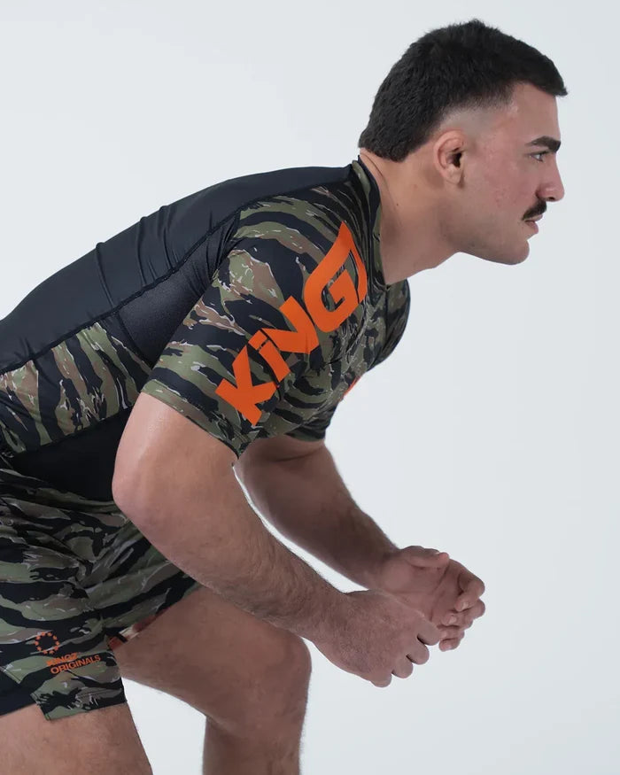 Kingz Always Hunting Rashguard Green Camo - Action Pose Grappling Stance Male Athlete Short Sleeve Tiger Camo Large KINGZ Orange Text Sleeve Camo Shorts BJJ Training [color:Green Camo]