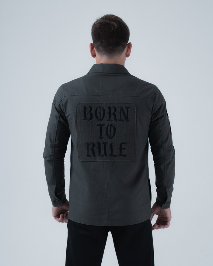 Kingz Born To Rule Canvas Jacket Military Green - Back View Male Athlete Large "BORN TO RULE" Text Panel Long Sleeve Button Cuffs Tailored Fit Outerwear BJJ Training [color:Military Green]