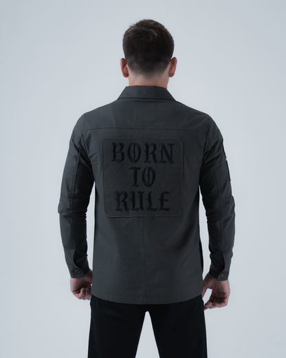 Kingz Born To Rule Canvas Jacket Military Green - Back View Male Athlete Large "BORN TO RULE" Text Panel Long Sleeve Button Cuffs Tailored Fit Outerwear BJJ Training [color:Military Green]