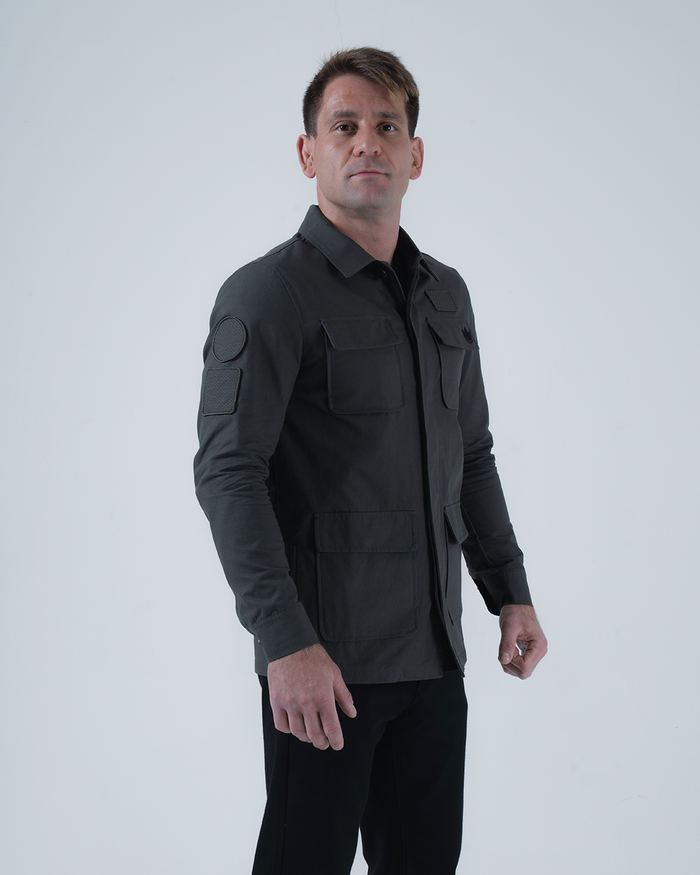 Kingz Born To Rule Canvas Jacket Military Green - Three Quarter View Male Model Flap Pockets Arm Patches Button Closure Tailored Fit Outerwear BJJ Training [color:Military Green]