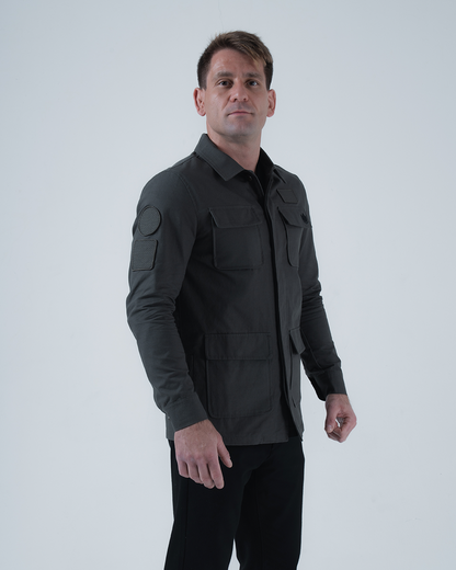 Kingz Born To Rule Canvas Jacket Military Green - Three Quarter View Male Model Flap Pockets Arm Patches Button Closure Tailored Fit Outerwear BJJ Training [color:Military Green]