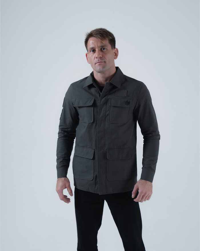 Kingz Born To Rule Canvas Jacket Military Green - Front View Male Model Four-Pocket Design Crown Badge Left Chest Structured Collar Casual Fit Outerwear [color:Military Green]