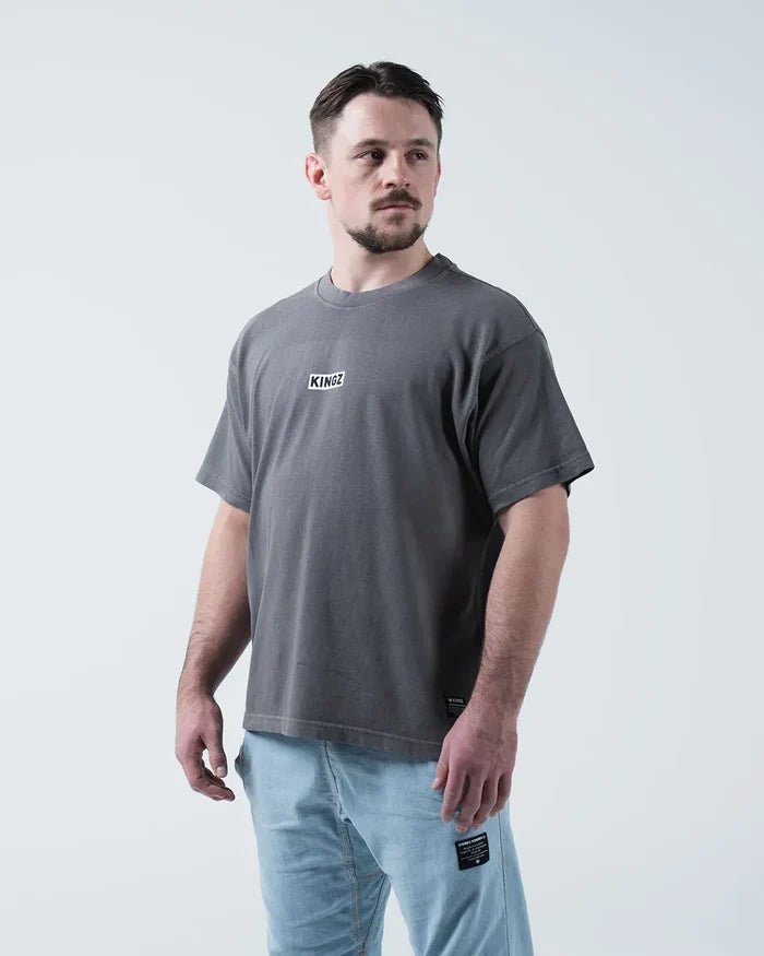 Kingz Box Tee - Front Three Quarter Angle - KINGZ Box Label Chest Worn With Light Wash Jeans - Grey BJJ Tee [color:Grey]