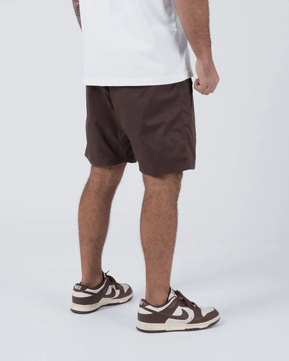Kingz Casual Gi Shorts Brown Dark Chocolate - Full Body Right Side Profile Male Athlete Dark Brown Ripstop Casual Shorts Relaxed Fit Above-Knee White T-Shirt Brown Nike Dunk Sneakers Men's BJJ Lifestyle [color:Earthy brown]