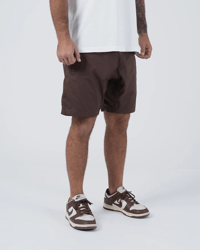 Kingz Casual Gi Shorts Brown Dark Chocolate - Full Body Left Side Profile Male Athlete Dark Brown Ripstop Casual Shorts Relaxed Fit Drawstring Waistband White T-Shirt Brown Nike Dunk Sneakers Men's BJJ Lifestyle [color:Earthy brown]