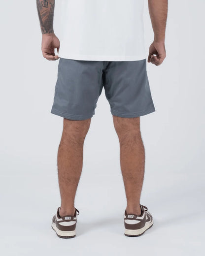 Kingz Casual Gi Shorts Grey Steel Blue-Grey - Full Body Back View Male Athlete Grey Ripstop Casual Shorts Clean Back Panel Back Pockets White T-Shirt Brown Nike Dunk Sneakers Men's BJJ Lifestyle [color:Grey]