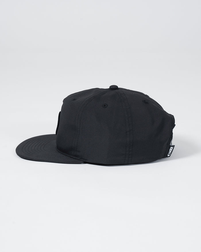 Kingz Crown Patch 5-Panel Strapback Hat - Black - Side View Black Hat Kingz Logo Tag on Brim Adjustable Strapback Design Casual Streetwear BJJ Training Hat [color:Black]
