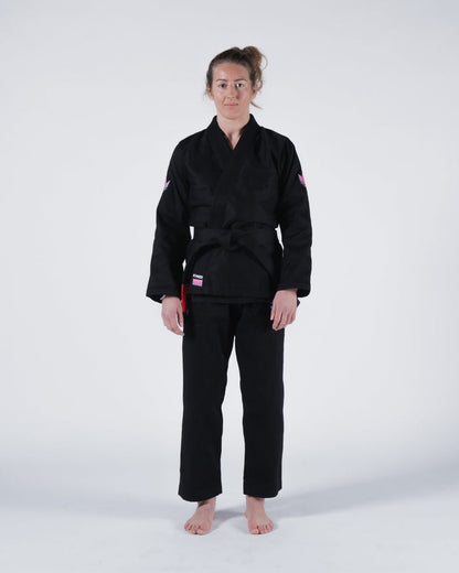 Kingz Empowered Women's Jiu Jitsu Gi Black - Full Body Front View Female Athlete Black Gi Pink Shoulder Patches KINGZ Logo Lapel Red Tag Hem Durable Fabric Women's BJJ Gi Training [color:Black]