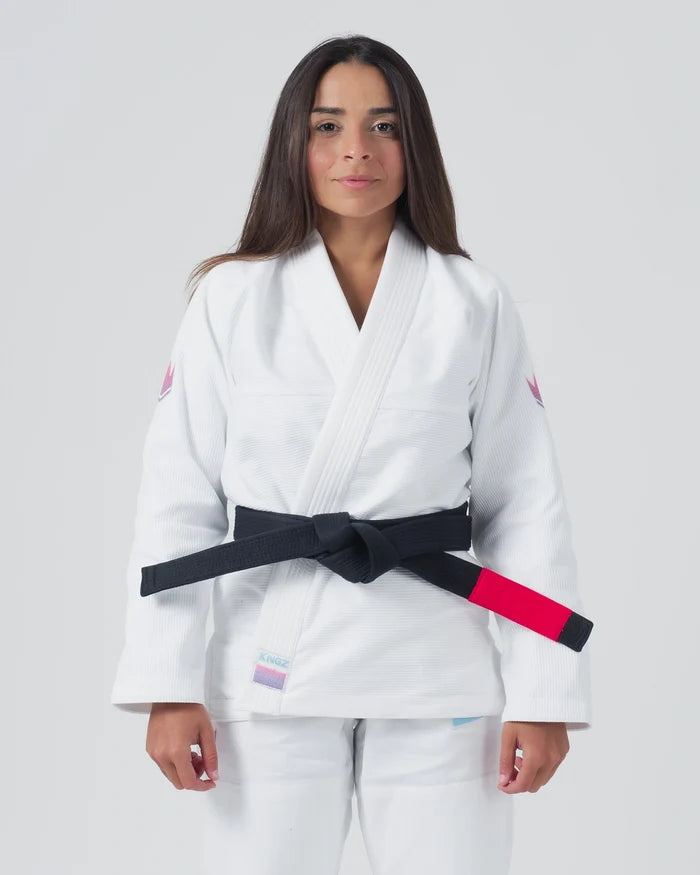Kingz Empowered Women's Jiu Jitsu Gi White - Front View Female Athlete Pink Crown Shoulder Patches Black Belt KNGZ Tag Lapel Clean Design Durable Fabric BJJ Gi Training [color:White]