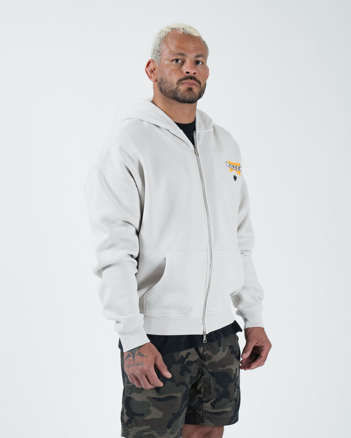 Grey BJJ zip up hoodie side profile view on adult male model showing full zipper and relaxed fit drape