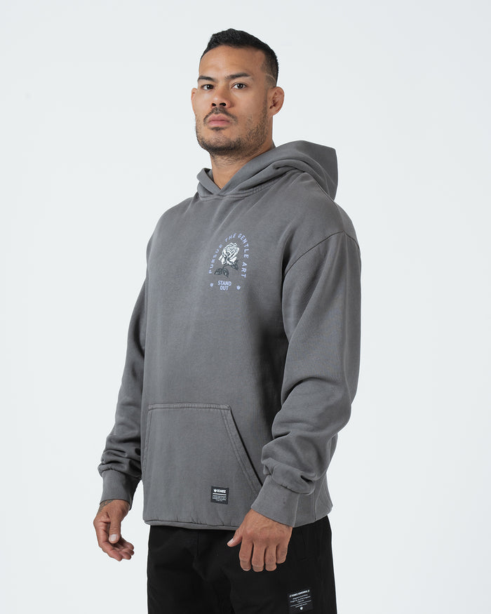 Grey BJJ hoodie front three-quarter view on adult male model highlighting rose graphic and heavyweight fit [color:Grey]