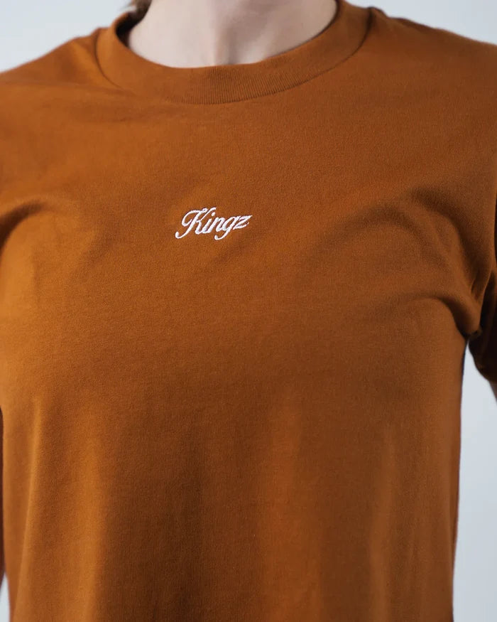 Kingz Women's Heavyweight Tee - Detail Shot - Kingz Script Embroidery Close-up - Vintage Orange Women's BJJ Tee [color:Vintage Orange]