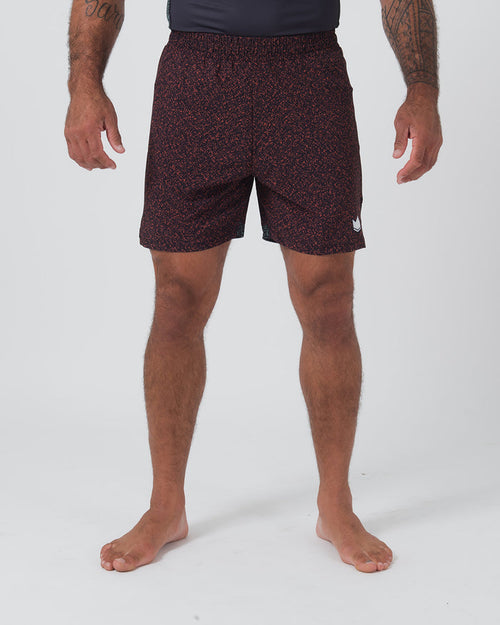 Kingz Hybrid Shorts Noise Red - Full Body Front View Male Athlete Dark Burgundy Maroon Red Noise Speckle Texture Pattern White Crown Logo Right Thigh Black Elastic Waistband Inner Compression Shorts Competition Cut Men's Grappling Shorts No-Gi BJJ [color:Noise Red]