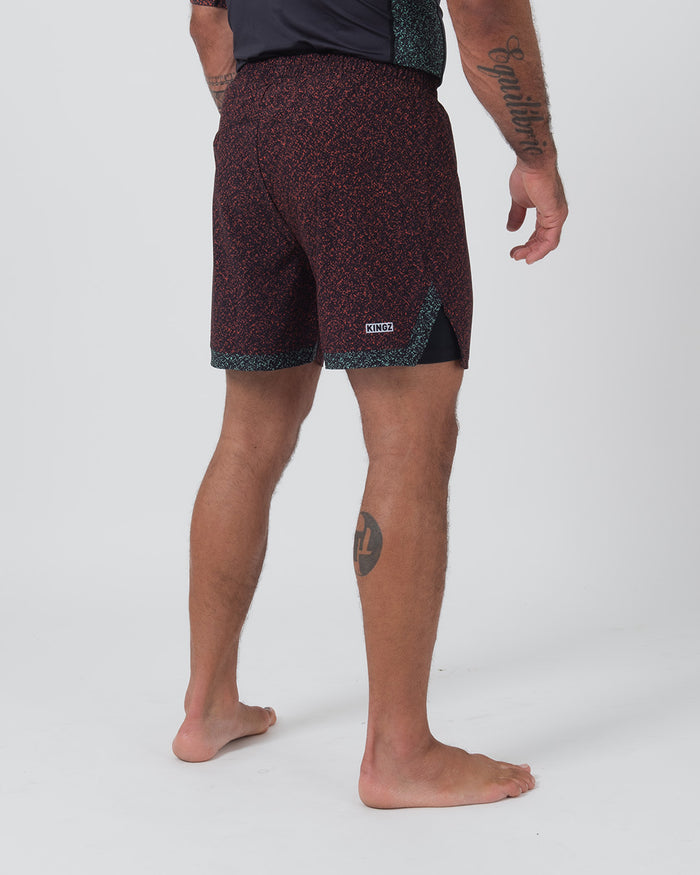 Kingz Hybrid Shorts Noise Red - Full Body Right-Back Side Profile Male Athlete Dark Burgundy Red Noise Pattern KINGZ Badge Right Side Inner Compression Shorts Teal Hem Visible Black Side Panels Men's Grappling Shorts No-Gi BJJ [color:Noise Red]